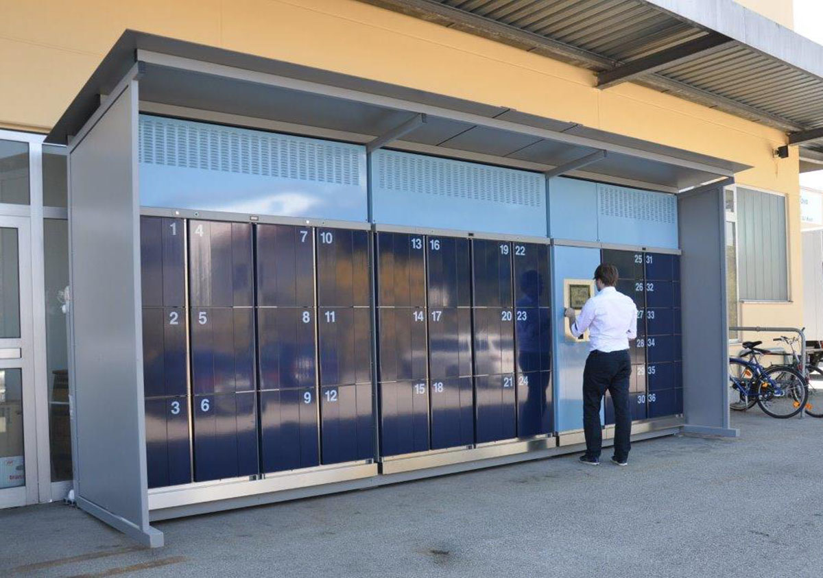 Pickup station cool lockers Pickup station cool lockers – temperature-controlled smart locker system partly covered outdoors. cool lockers with chilled, freezing and heated compartments.